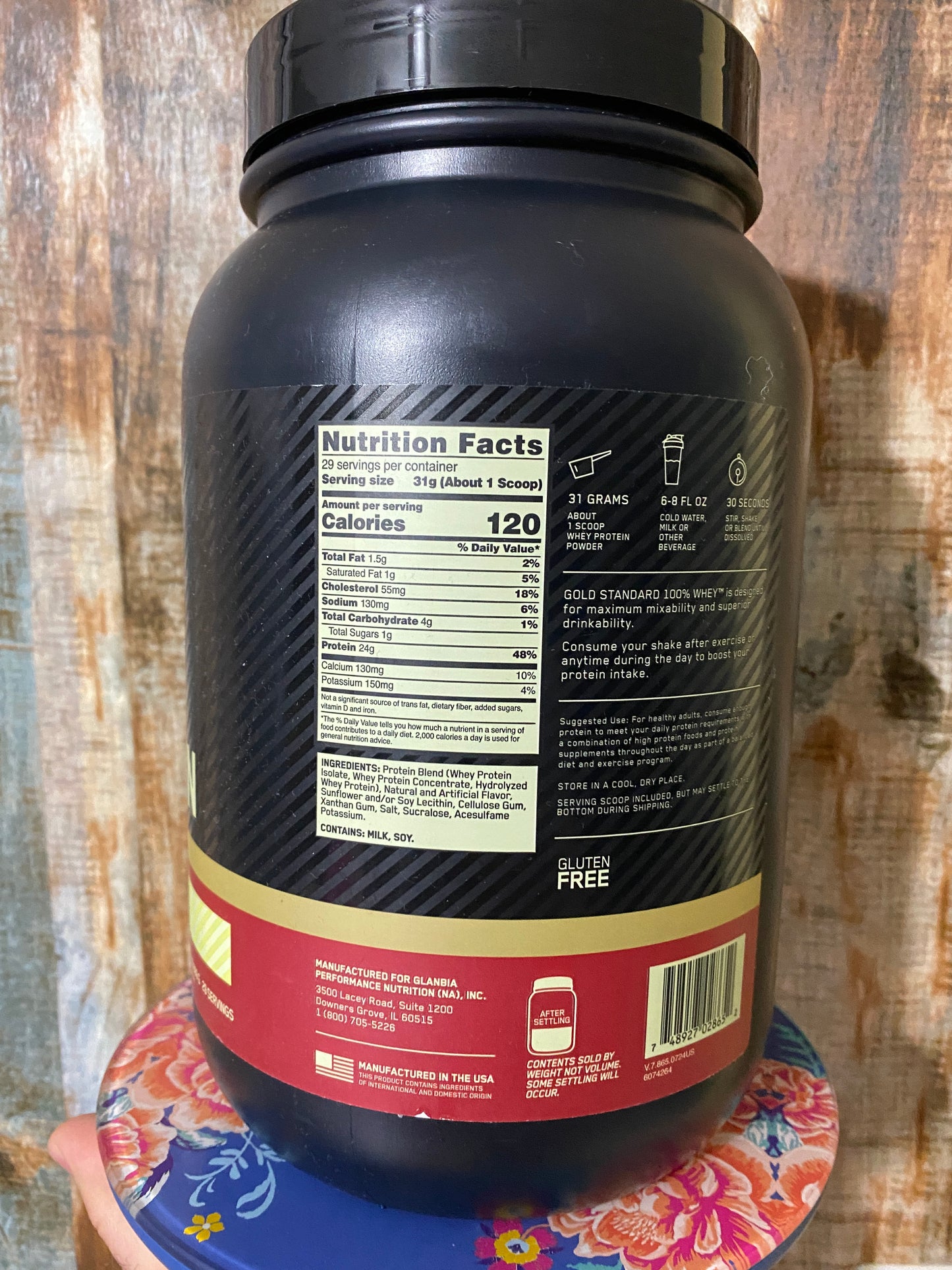 Supplement bottle with label on a wooden surface