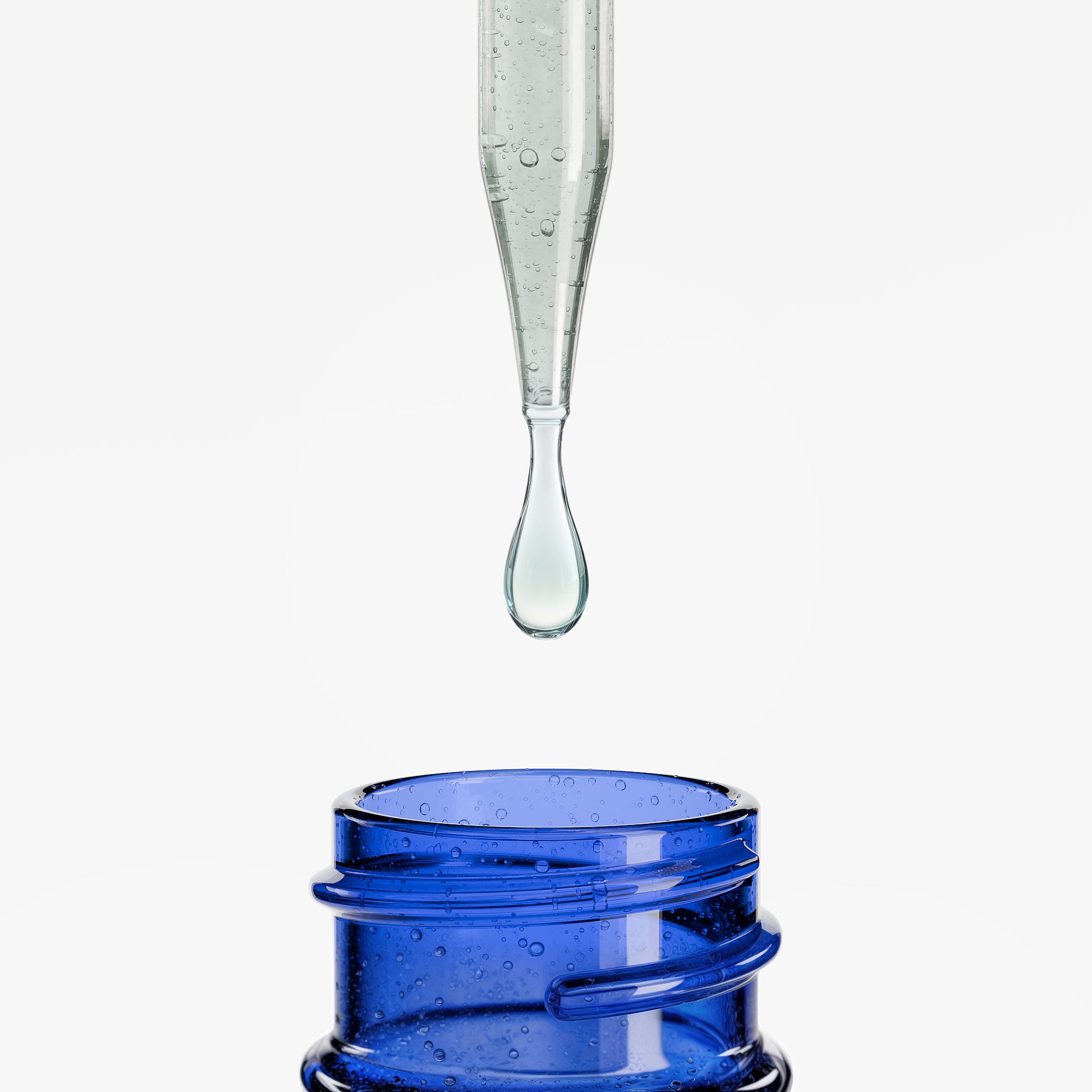 Roksy diet supplement dropper releasing liquid into a blue bottle for weight management